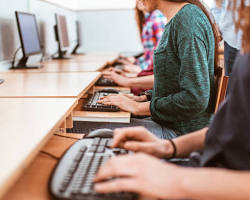 Hình ảnh về Students in a computer lab taking a test